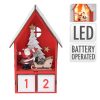 Dekorációs figura, adventi naptár LED világítással (piros házikóban Mikulás és szánja)