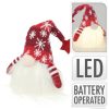 Karácsonyi dekorációs figura LED világítással (kicsi manó piros sapkában)